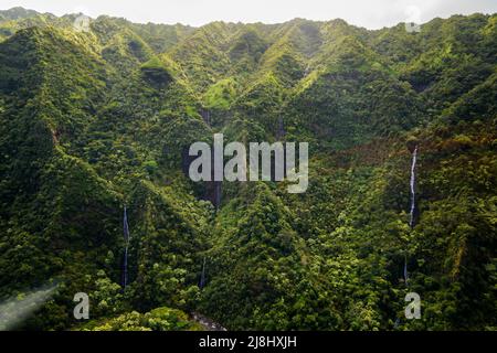 Aerial view of Hanapepe Valley on Kauai island, Hawaii, United States - Multiple waterfalls in a lush tropical landscape