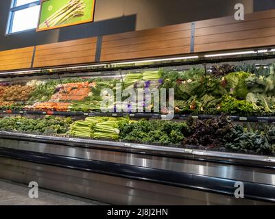 Mill Creek, WA USA - circa April 2022: Wide view of organic produce for sale inside a Town and Country grocery store. Stock Photo