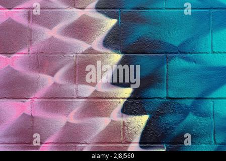 Colorful painted block wall in city alley. Stock Photo