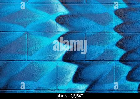 Colorful painted block wall in city alley. Stock Photo