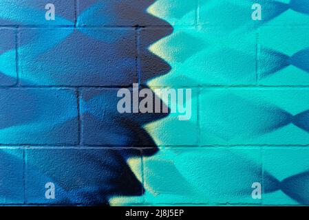 Colorful painted block wall in city alley. Stock Photo