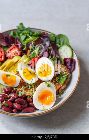 Medium boiled eggs with sasld, healthy breakfast Stock Photo