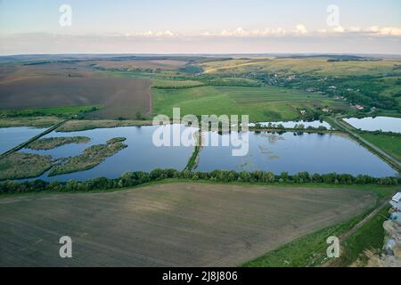 Aerial view of fish hetching pond with blue water in aquacultural area Stock Photo