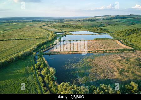 Aerial view of fish hetching pond with blue water in aquacultural area Stock Photo