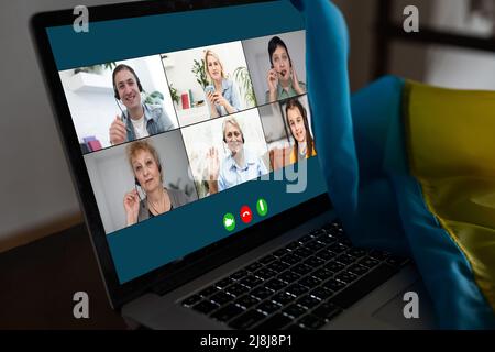 Laptop screen webcam view different ethnicity and age people engaged in group videocall. Video conference. Modern technology, easy convenient on-line Stock Photo