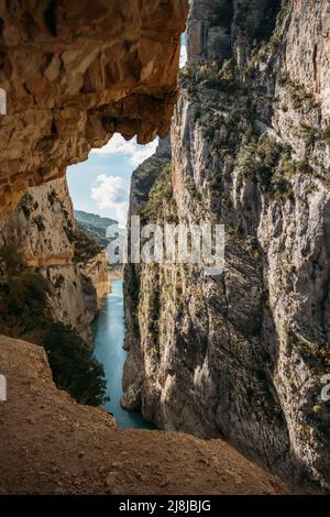 A path excavated in the rock allows to cross Congost de Mont-Rebei defile. Famous hiking trail in Spain. Stock Photo