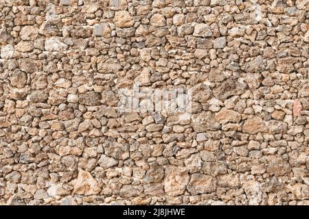 Dry stone wall, drystone walling. Seamless repeating (tileable) pattern, texture or background. Stock Photo