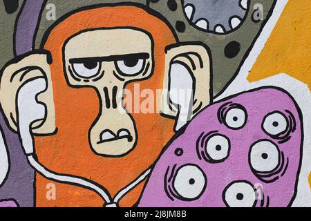 Costa Rica street art - Graffiti artwork, showing a monkey with headphones and skateboard. Unknown artist Stock Photo