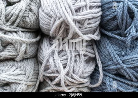 tangles of multicolored thick woolen threads. background. knitting  Stock Photo