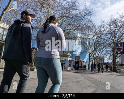 Seattle, WA USA - circa April 2022: View of people walking around and enjoying a sunny day near the Seattle Center area in the downtown district. Stock Photo