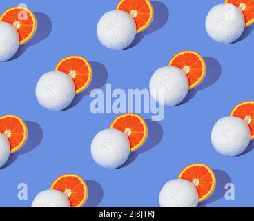 Pattern made of white painted grapefruit cut in half. Minimal summer concept. Stock Photo
