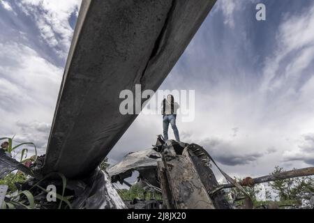 Kharkiv, Ukraine. 16th May, 2022. A videographer films an Mi-28 helicopter, downed in early March, in a field east of Kharkiv in Biskvitne, Ukraine, Monday, May 16, 2022. Ukrainian forces said Monday their counteroffensive in the second-largest city of Kharkiv has allowed them to push back Russian forces in one of the most significant setbacks for Moscow since the start of its invasion. Photo by Ken Cedeno/UPI Credit: UPI/Alamy Live News Stock Photo