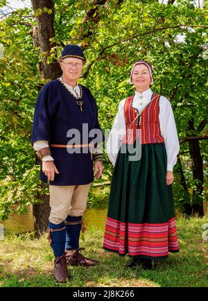 People in traditional clothing, Freedom Square, Riga, Latvia Stock Photo