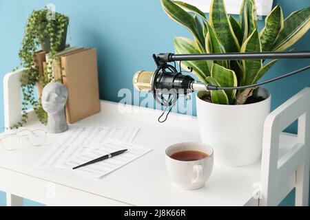Stand with professional microphone near modern workplace of composer Stock Photo