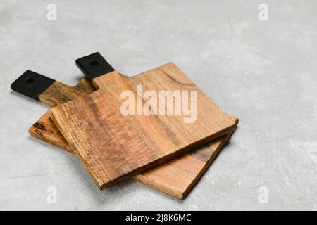 Wooden cutting boards on grey background Stock Photo