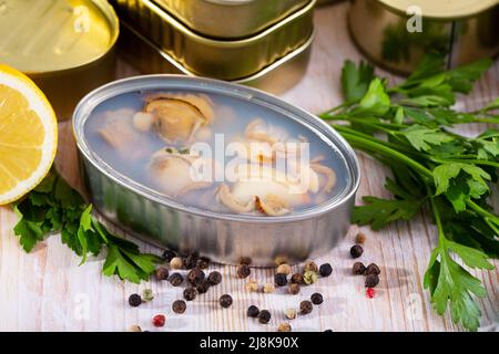 Canned seafood, whole shelled clams Stock Photo