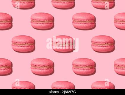 Pink colored french cookies on pastel background Stock Photo