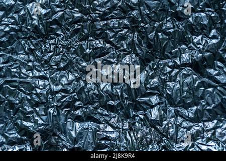 Abstract texture pattern metallic paper using as a background or wallpaper. Metal aluminum foil shiny and reflector. High quality photo Stock Photo