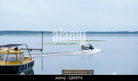Motor boats moored at the pier Stock Photo