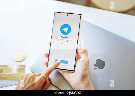 CHIANG MAI, THAILAND May 13 2022 : Telegram application icon on smartphone mobile screen close-up. Telegram app icon. Telegram is an online social Stock Photo