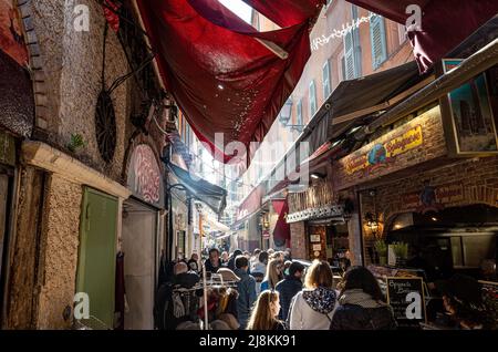 Crowded street in Old Town Nice, France 12/2019 Stock Photo