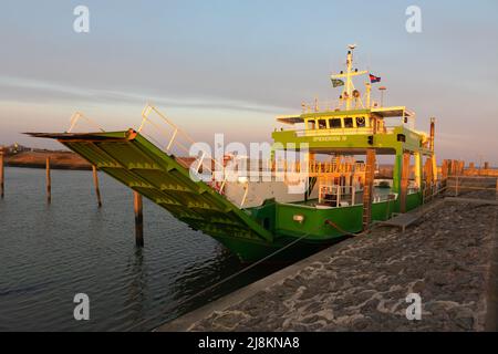 Ferry in the harbour of Neuharlingersiel at dawn, Germany Stock Photo