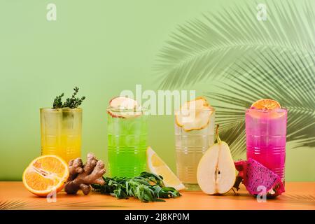 Variety of iced beverages or lemonade in tall facetted glasses Stock Photo