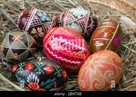 holiday Easter eggs painted ornaments on hay Stock Photo