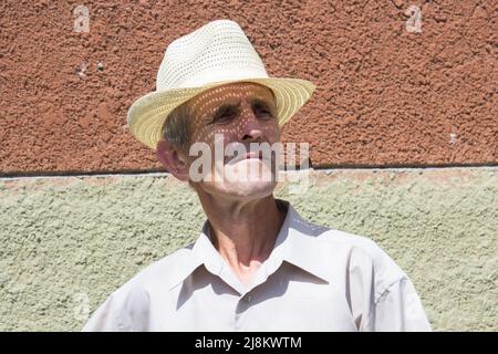 portrait of grandfather in hat in summer Stock Photo