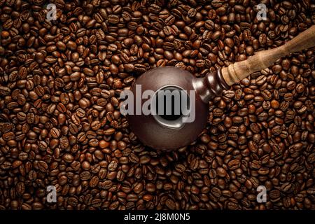 Coffee beans seamless background with turkish cezve pot Stock Photo