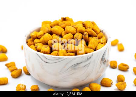 Gravy corn nuts on a white background. Close-up corn with sauce. Local name soslu mısır Stock Photo