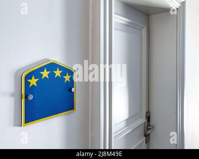 Four stars apartment badge next to accommodation door, selective focus Stock Photo