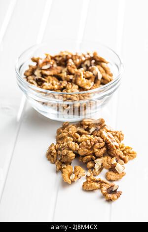 Peeled walnut kernels on a white table. Stock Photo