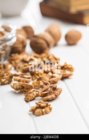 Peeled walnut kernels on a white table. Stock Photo
