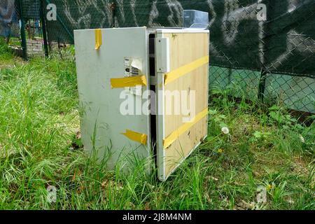 Discarded old broken fridge, Berlin, Germany Stock Photo