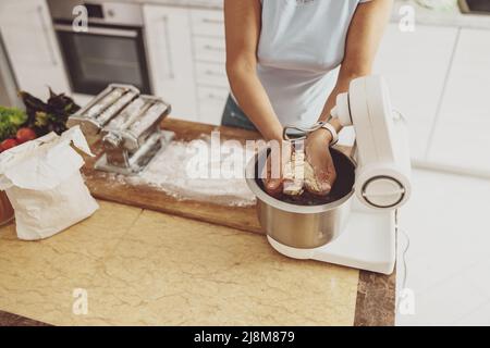 Contemporary White Kitchen with Concrete Countertop, Pull-Out Cutting Board  Stock Photo - Alamy