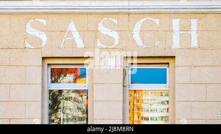 Minsk, Belarus - March 24, 2022: Trace of the SASCH sign on the facade of the store. Concept of leaving brands from Russia and Belarus. Stock Photo