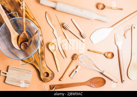 top view of various kitchen utensils laid out on a light background. modern kitchen background. flat lay Stock Photo