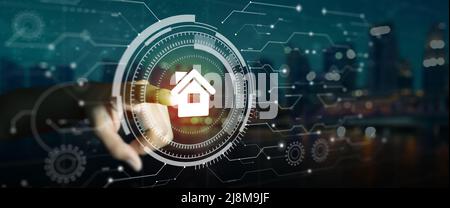 User hand touching circular futuristic digital interface of smart home automation control system. Automation assistant, Innovation technology. Stock Photo