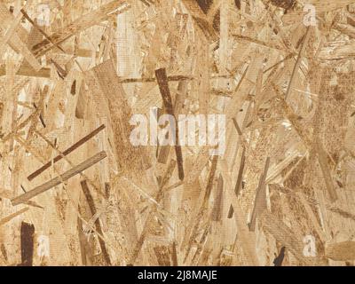 OSB texture of the material - recycled compressed wood chips plate, plywood texture, close-up Stock Photo