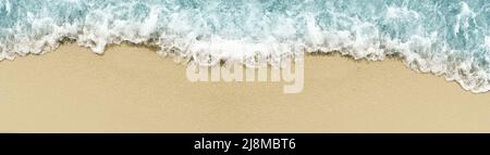Background image of a soft wave of the blue ocean on a sandy beach. Ocean wave is closed with copy space for text Stock Photo