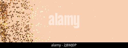 Banner with gold colored stars confetti scattered on a beige background with copyspace. Stock Photo