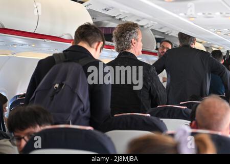 France. 16th May, 2022. People wait for their plane departures at Orly Airport in Paris, France on May 16, 2022. Wearing mask is no longer mandated after Covid-19 coronavirus cases dropped. (Photo by Lionel Urman/Sipa USA) Credit: Sipa USA/Alamy Live News Stock Photo