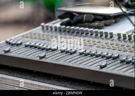 Sound and audio mixer control panel with buttons and sliders. Audio sound mixer console. close-up Stock Photo