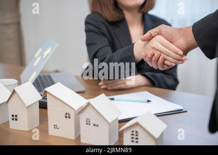 Cropped Image Of People Shaking Hands Over Desk. Stock Photo