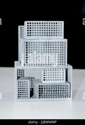 Models printed on 3D printer. Gray plastic objects printed on 3D printer. Stock Photo