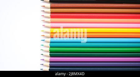 A set of colored pencils isolated on a white background in banner format. Place for text Stock Photo