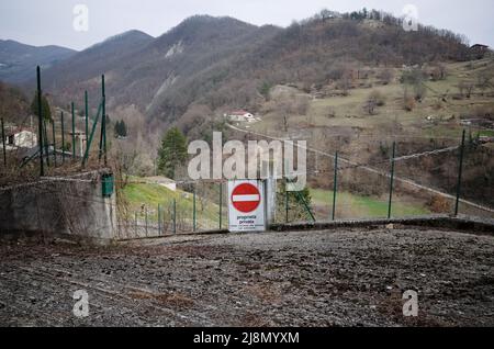Do Not Enter road sign with inscription Proprieta Privata means Private Property from italian. Chain with road sing Vehicles are not allowed Stock Photo