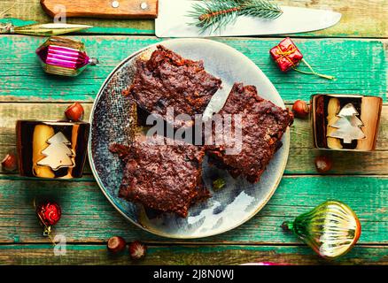 Panforte, tasty Christmas pie made from dried fruits and nuts. Panforte is an Italian Christmas cake.Brownie Stock Photo