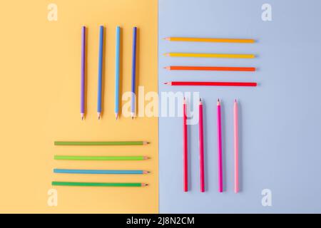 a few colored pencils on a yellow-blue background Develop creativity Get creative Stock Photo